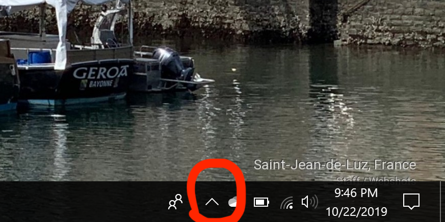To completely Exit Webshots click the Tray Icon area shown here: